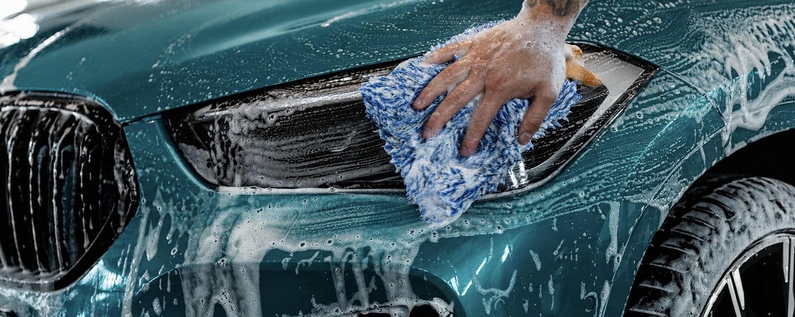 Hand polishing a vehicle